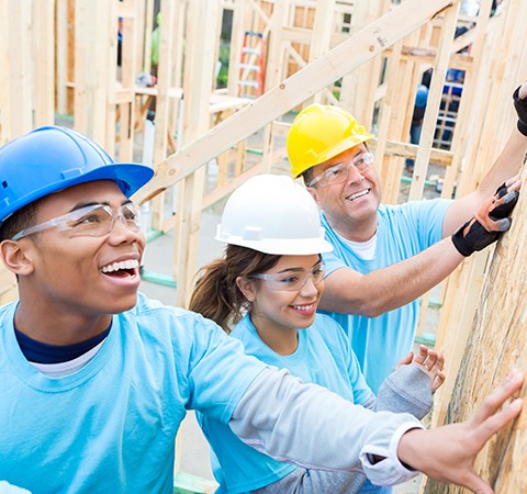 volunteers building home