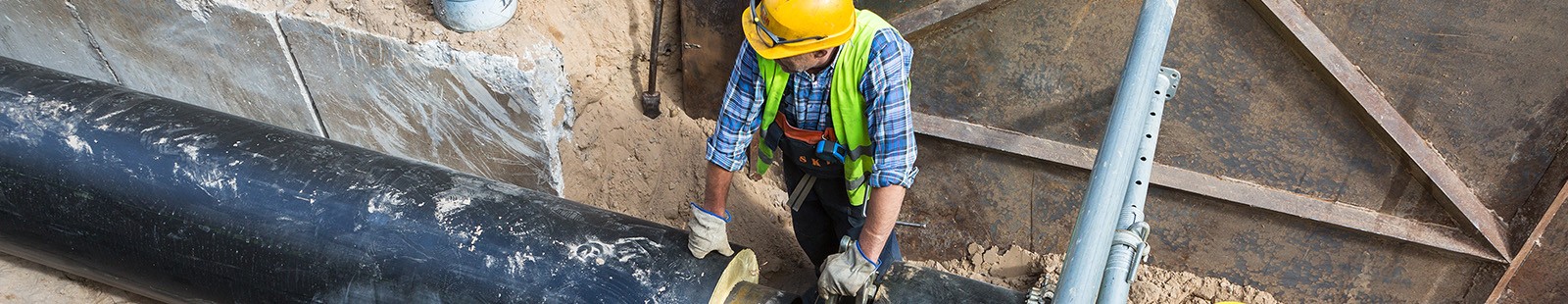 construction worker working on sewer line