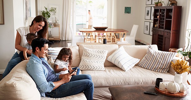 family sitting on sofa