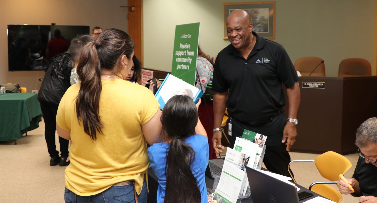 family receiving free energy-saving kits 