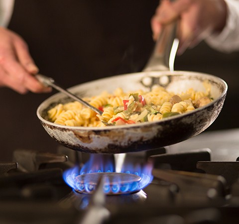 cooking in skillet over stove
