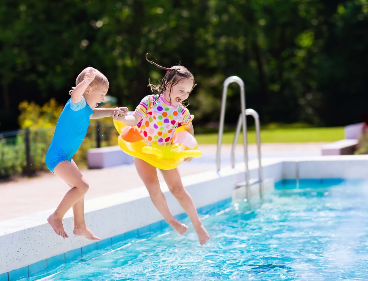 Child by swimming pool